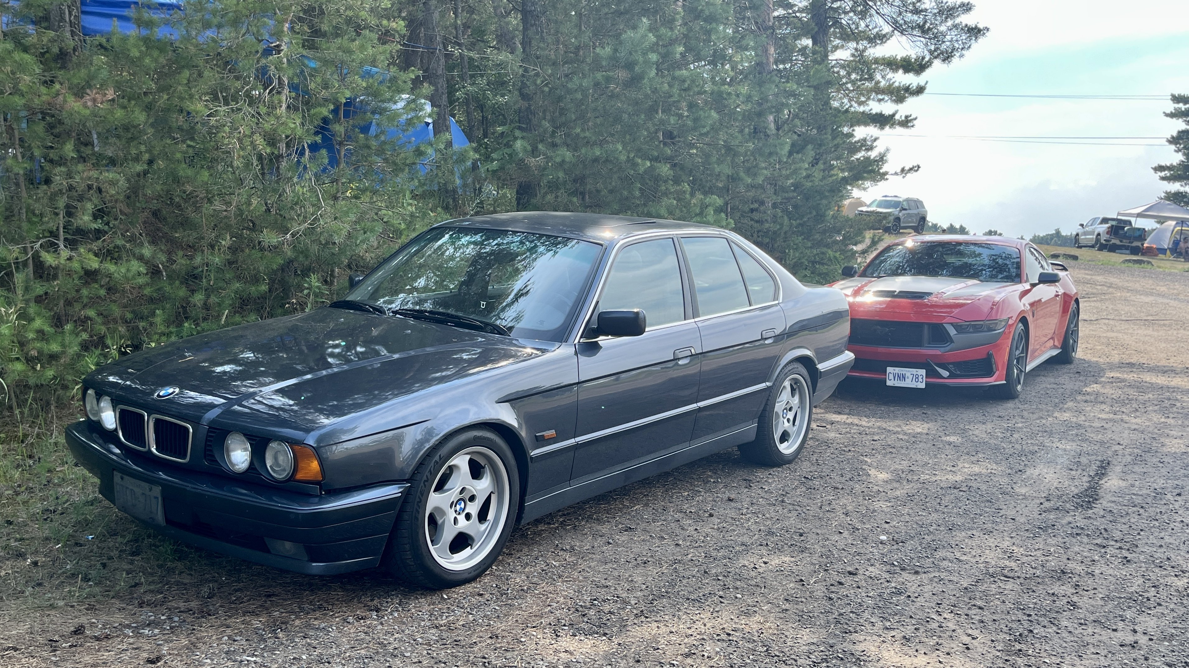 BMW 5-Series E34 and Ford Mustang Dark Horse | Photo: Germain Goyer