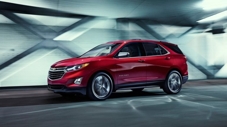2018 red Equinox, dynamic front three-quarter view in a tunnel