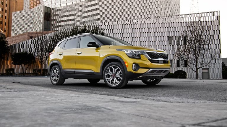 Yellow 2021 Kia Seltos seen from the front three-quarter