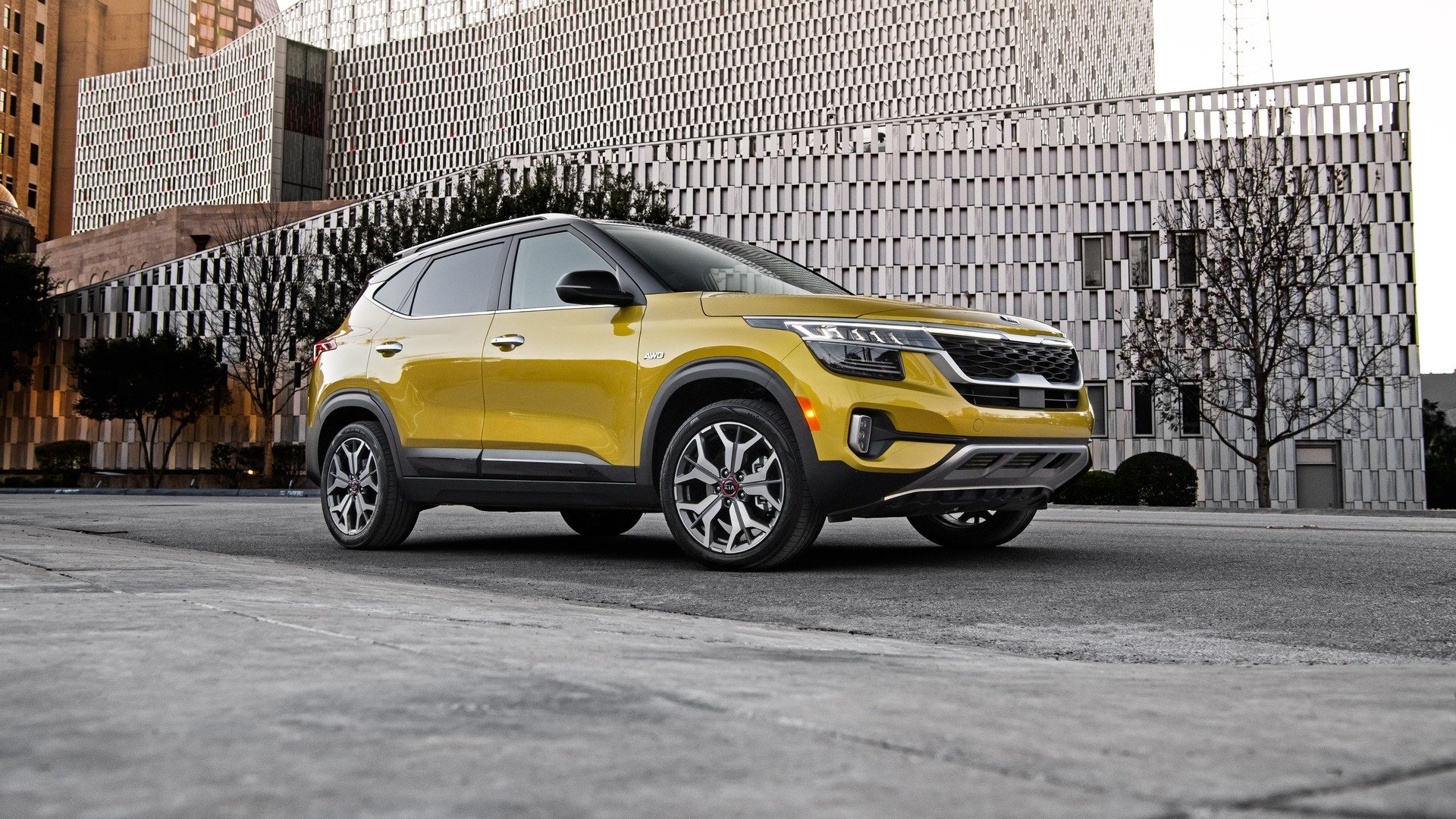 Yellow 2021 Kia Seltos seen from the front three-quarter