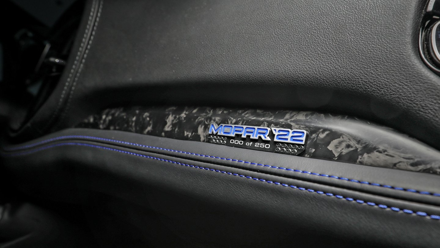 Mopar ‘22 badge reading “000 of 250” on a Dodge Durango dashboard with blue contrast stitching
