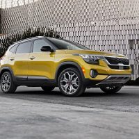 Yellow 2021 Kia Seltos seen from the front three-quarter