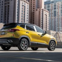 Rear of a yellow 2022 Kia Seltos seen from three-quarter