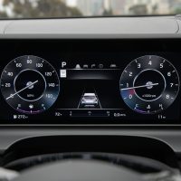 Digital gauges of the 2025 Kia Seltos seen through the steering wheel